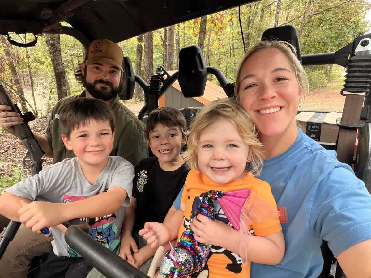 Cody and Amanda Morris with their kids out on the property — Grit and Iron LLC